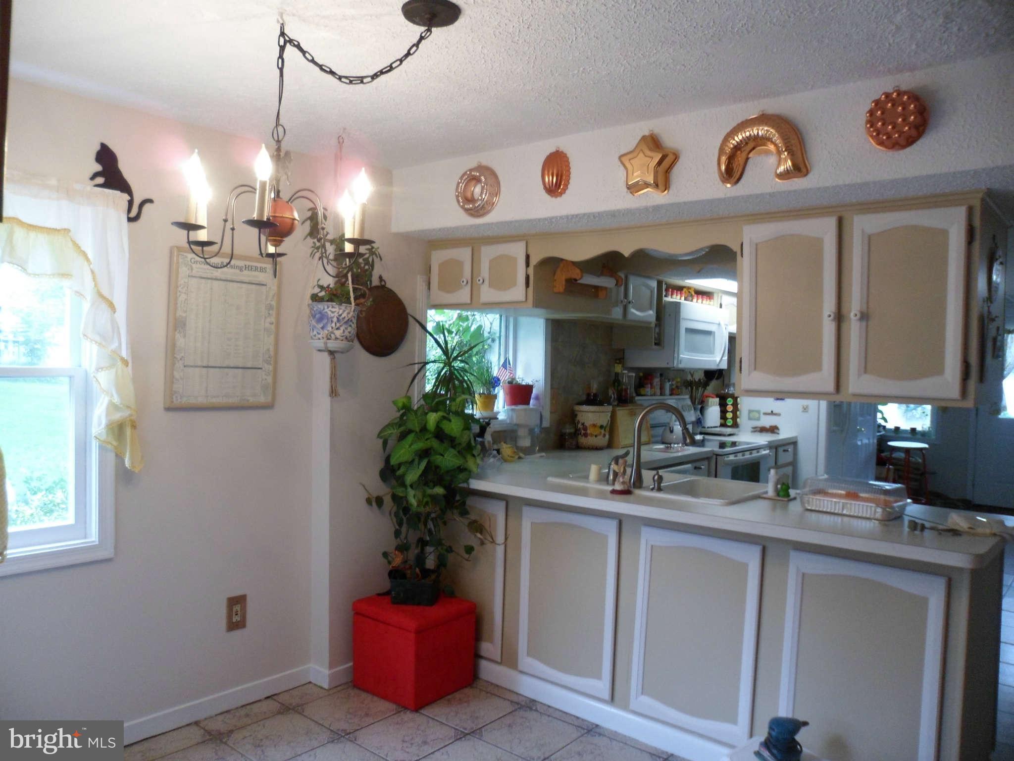 2990 Sixes Road Prince Frederick, MD 20678 - Photo 24 of 30 a view of living room kitchen and entryway