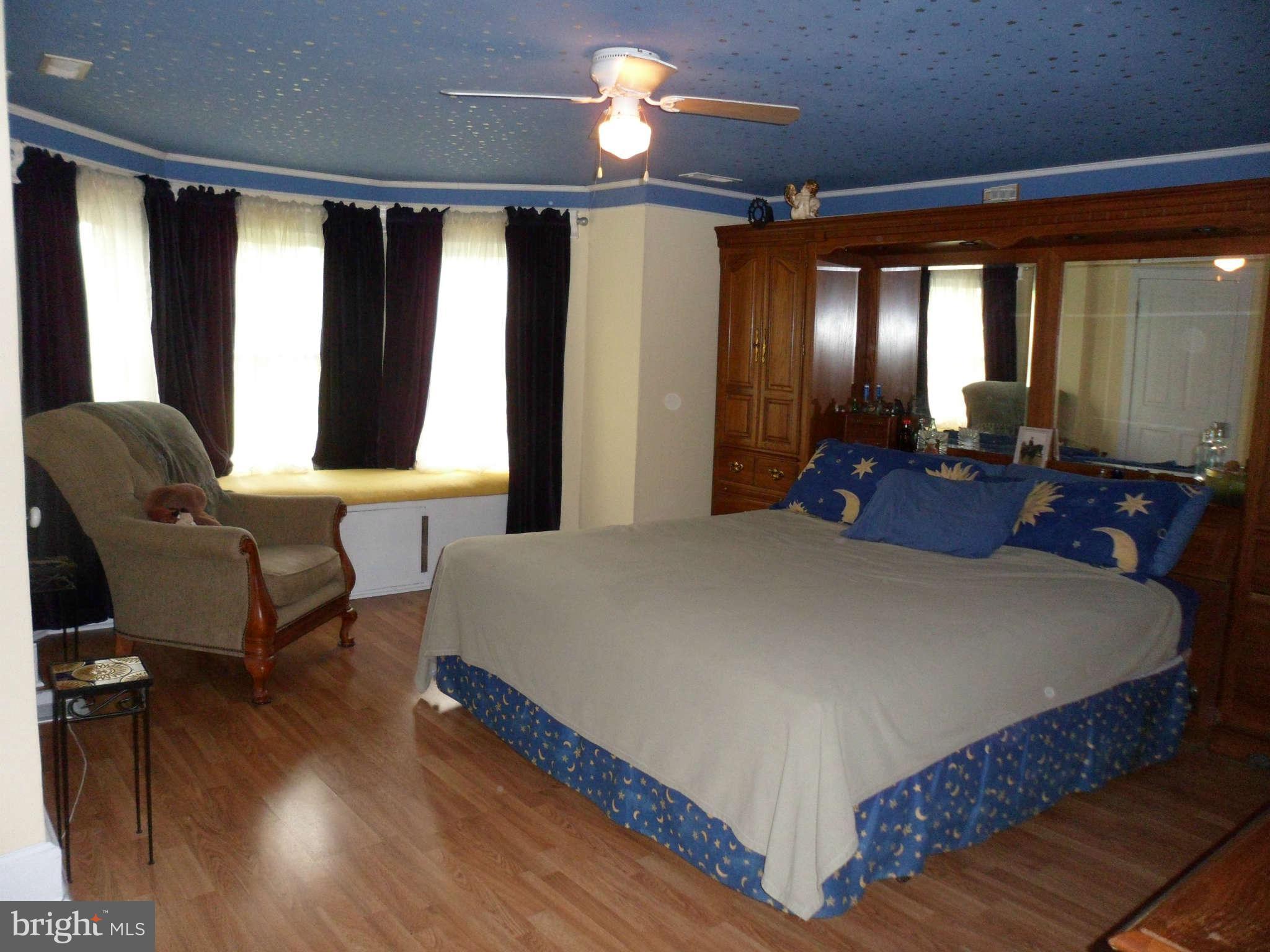 2990 Sixes Road Prince Frederick, MD 20678 - Photo 27 of 30 a bed room with a bed and a chair