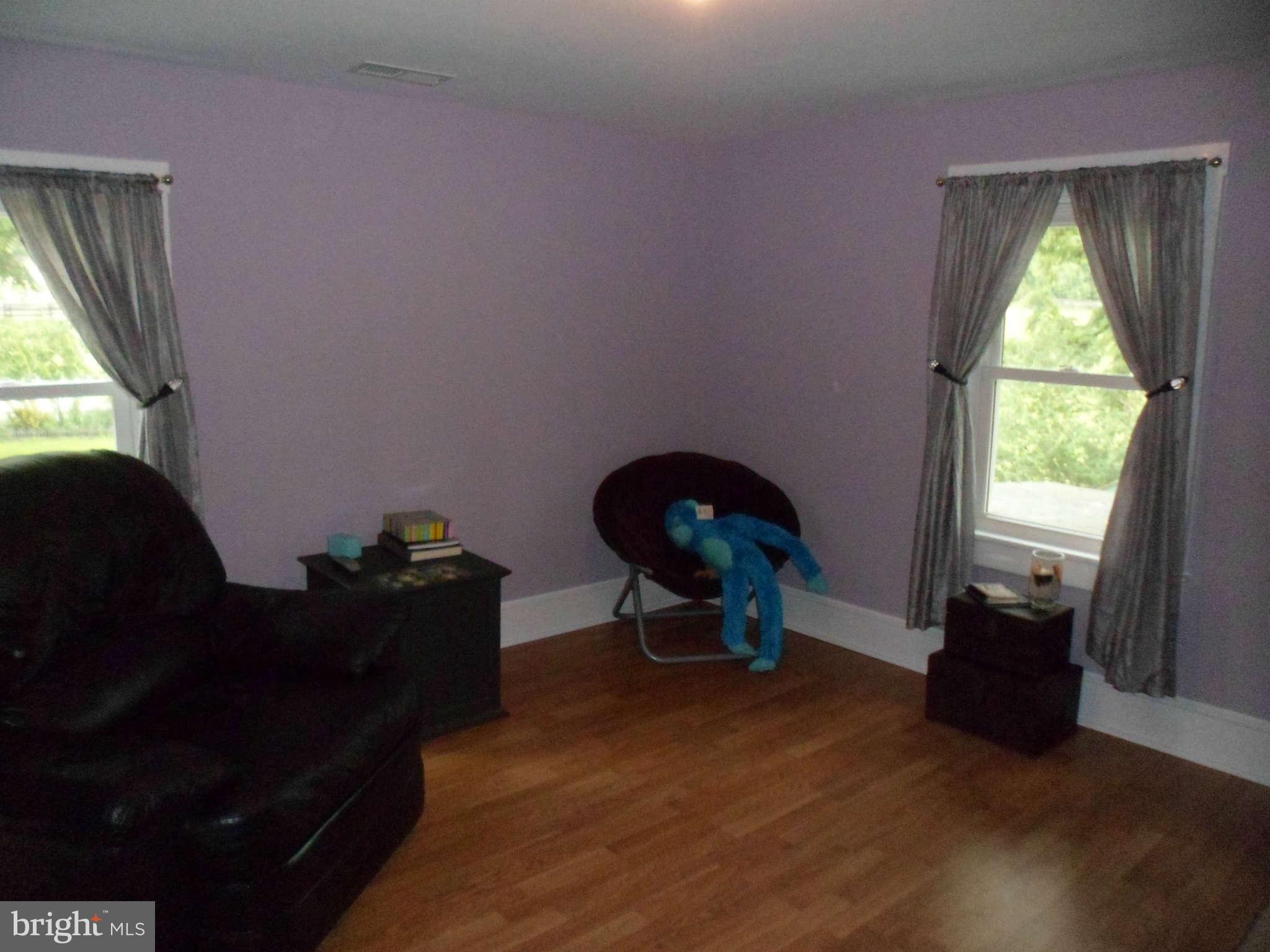 2990 Sixes Road Prince Frederick, MD 20678 - Photo 28 of 30 a living room with furniture and a windows