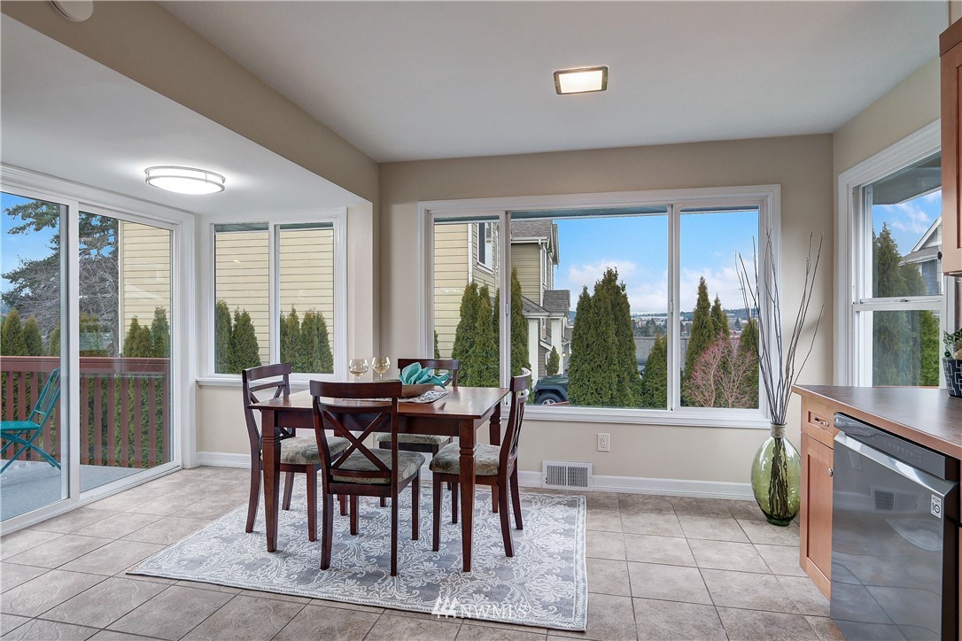 306 South 15th Street Renton, WA 98055 - Photo 12 of 22 a view of a dining room with furniture window and outside view
