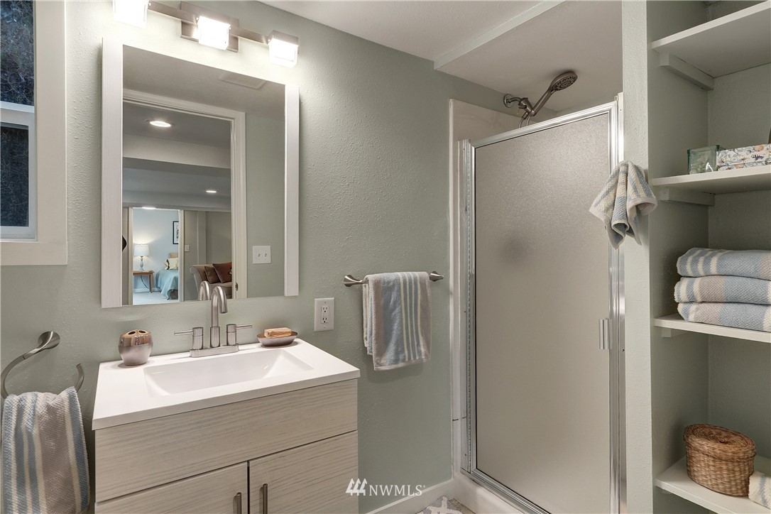 306 South 15th Street Renton, WA 98055 - Photo 17 of 22 a bathroom with a sink toilet and shower