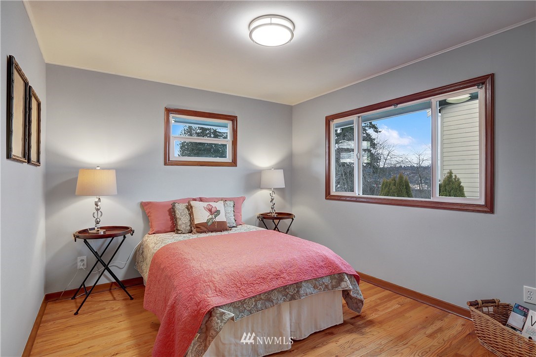 306 South 15th Street Renton, WA 98055 - Photo 8 of 22 a bed room with a bed and a painting on the wall