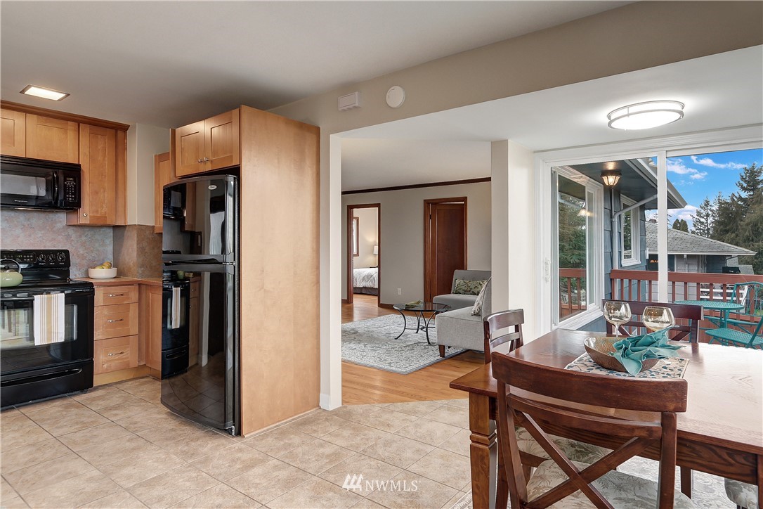 306 South 15th Street Renton, WA 98055 - Photo 10 of 22 a kitchen with stainless steel appliances kitchen island granite countertop a refrigerator and a stove top oven