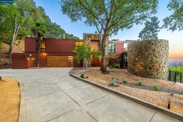 a tree in front of a house