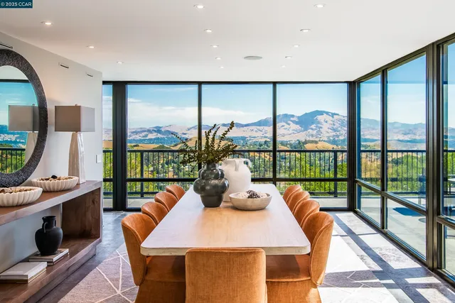 a dining room with a table and chairs