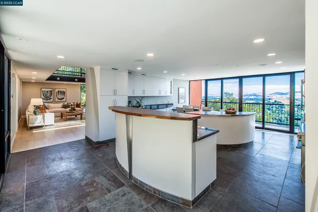 a kitchen with stove a sink and cabinets