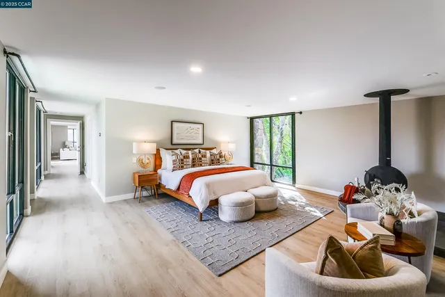 a living room with furniture a window and a ceiling fan