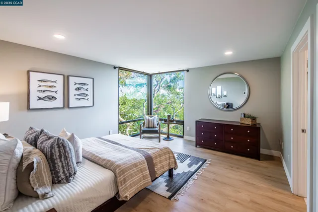 a room with large window and a flat screen tv