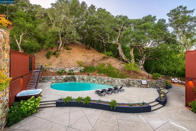 a view of a swimming pool with a patio