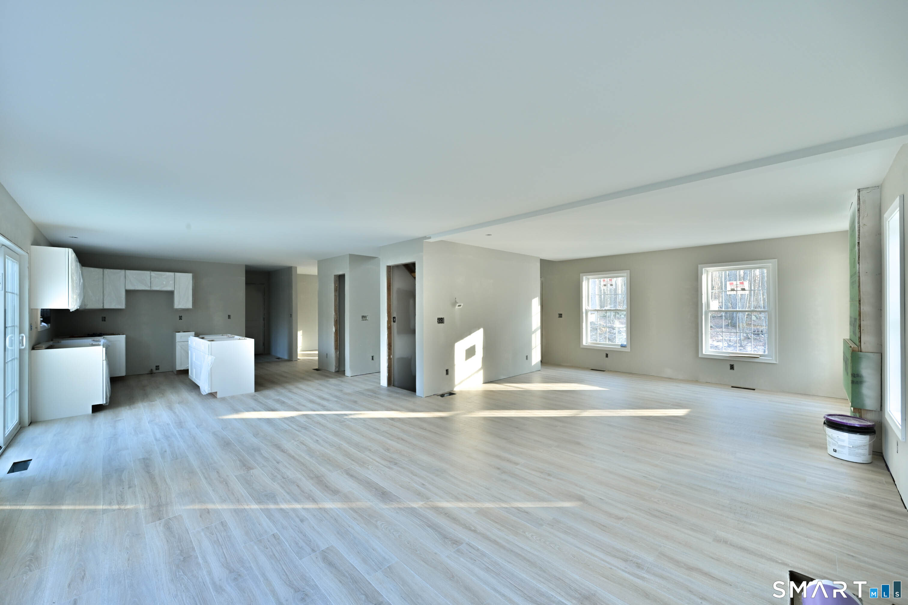 401 Tripp Hollow Road Canterbury, CT 06331 - Photo 13 of 39 a view of an empty room with wooden floor and a window