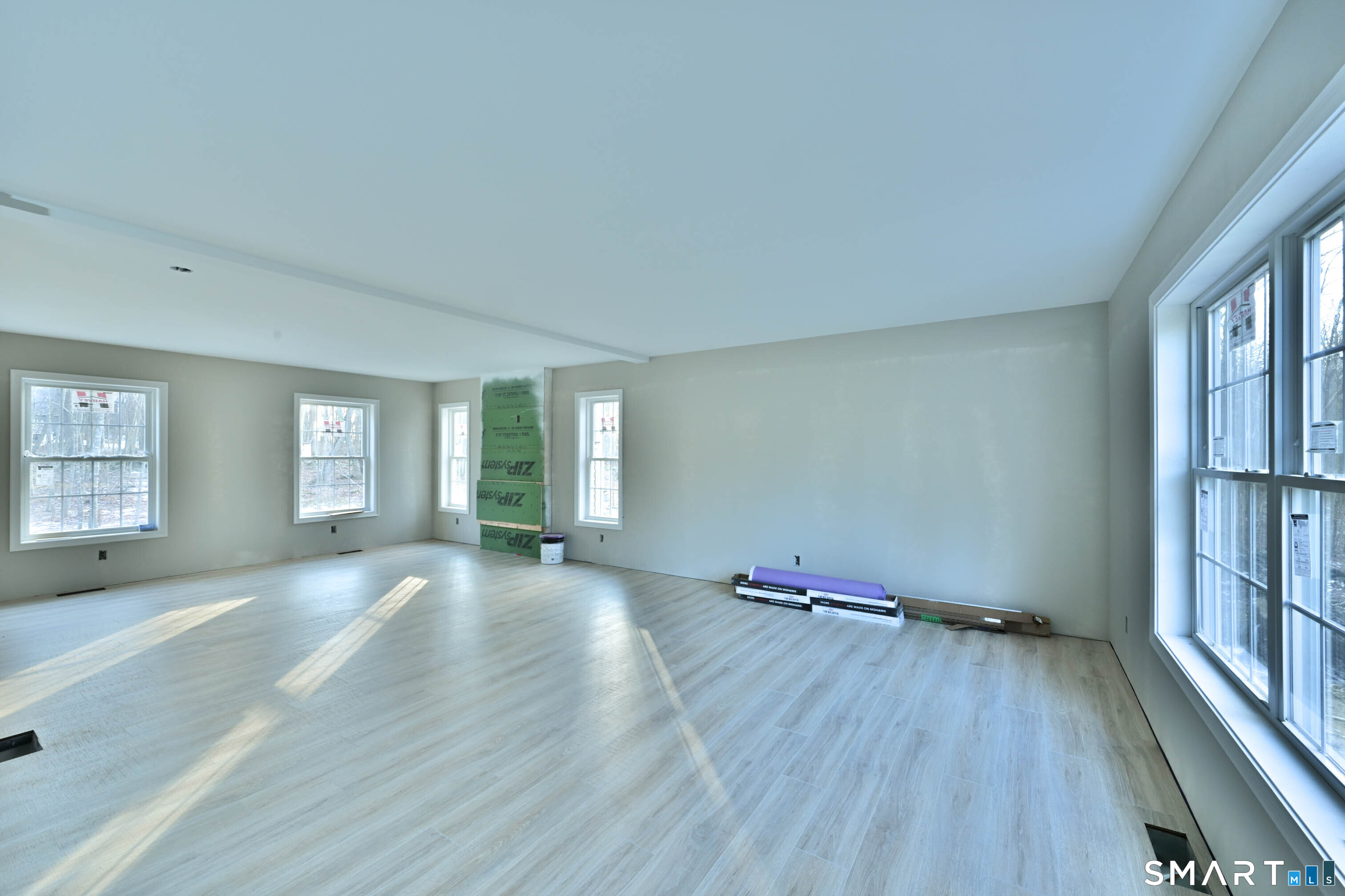 401 Tripp Hollow Road Canterbury, CT 06331 - Photo 14 of 39 an empty room with wooden floor and windows