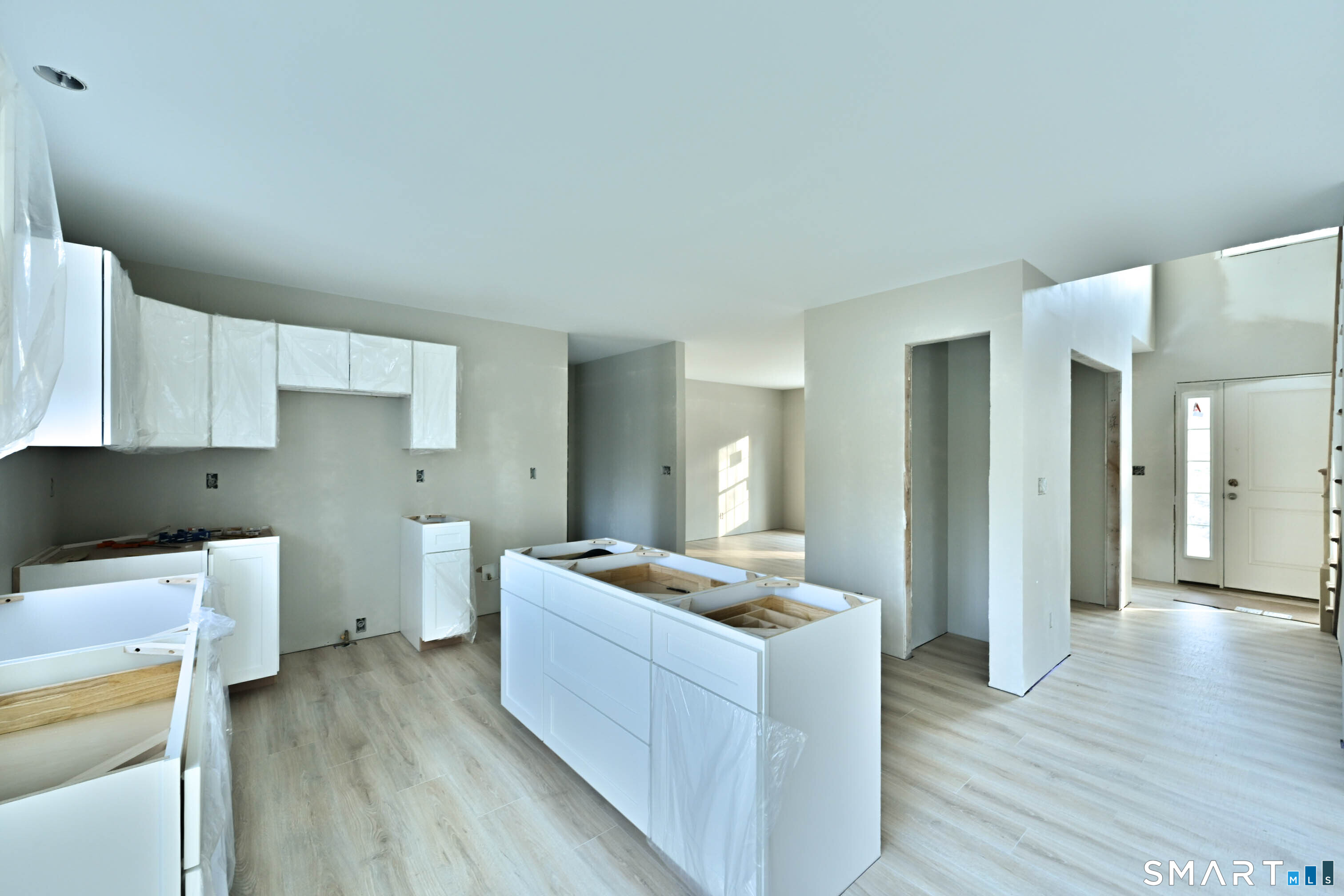 401 Tripp Hollow Road Canterbury, CT 06331 - Photo 16 of 39 a kitchen with a sink and wooden floor