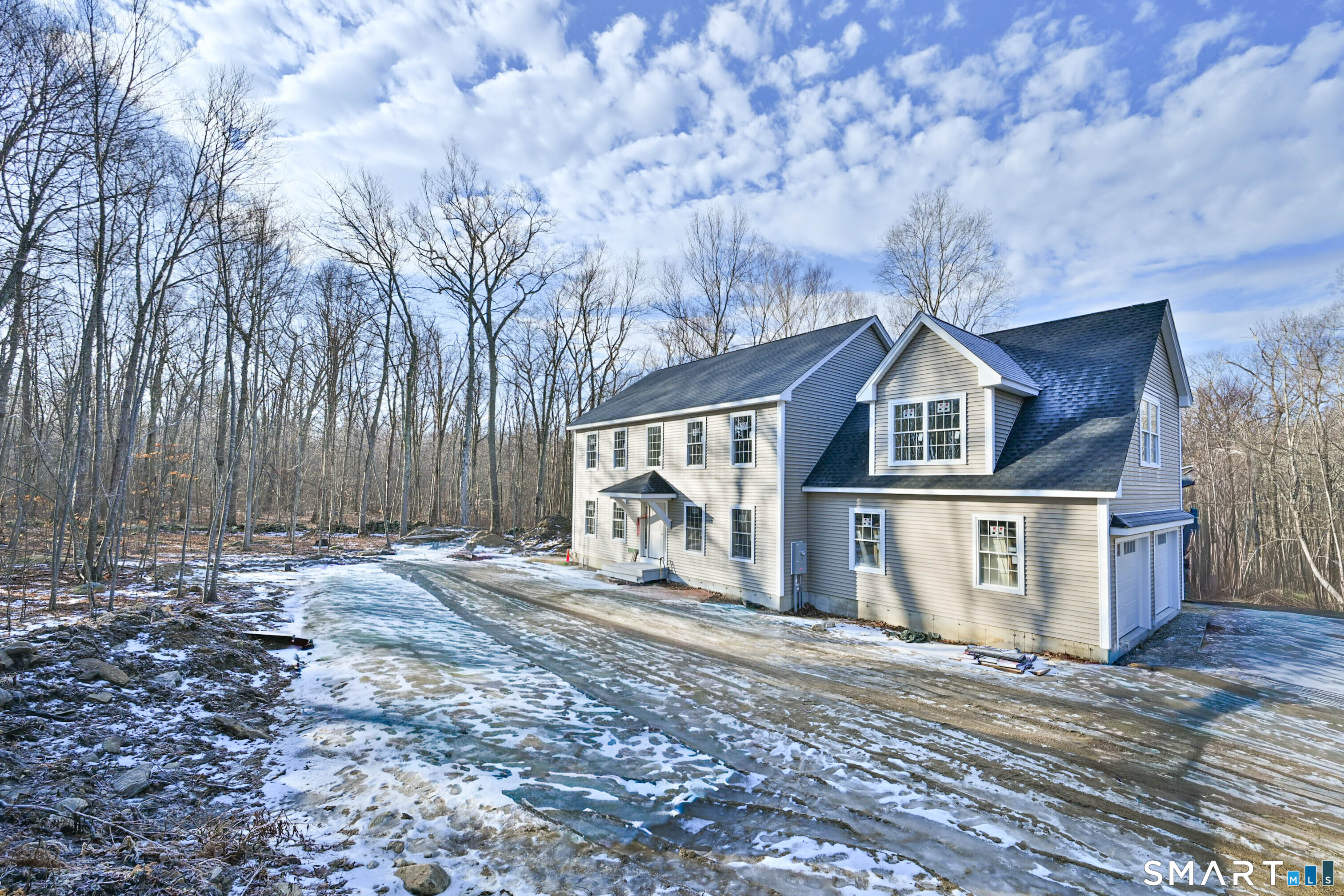 401 Tripp Hollow Road Canterbury, CT 06331 - Photo 2 of 39 a front view of a house with a yard and garage
