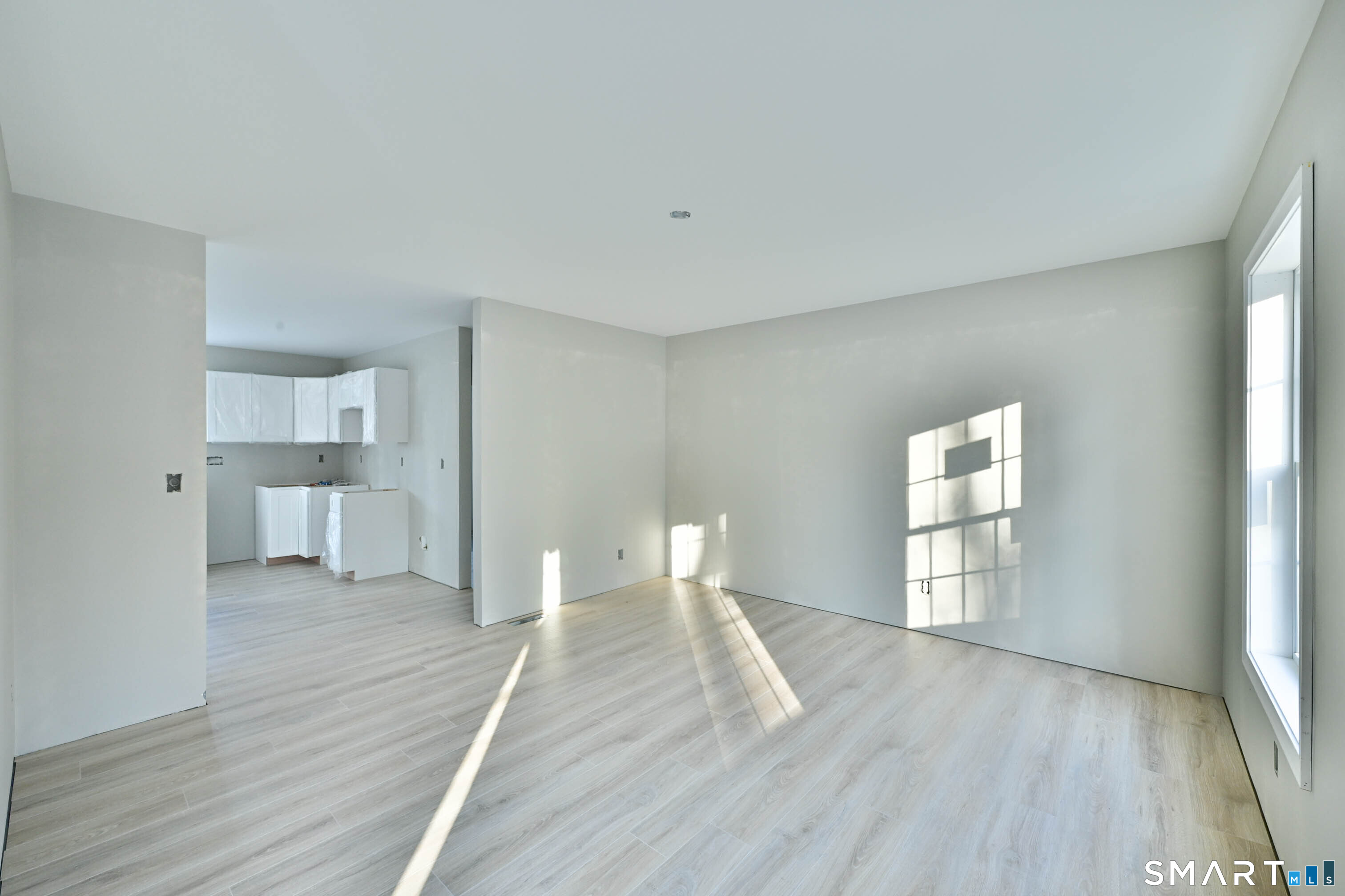 401 Tripp Hollow Road Canterbury, CT 06331 - Photo 25 of 39 a view of empty room with wooden floor and window