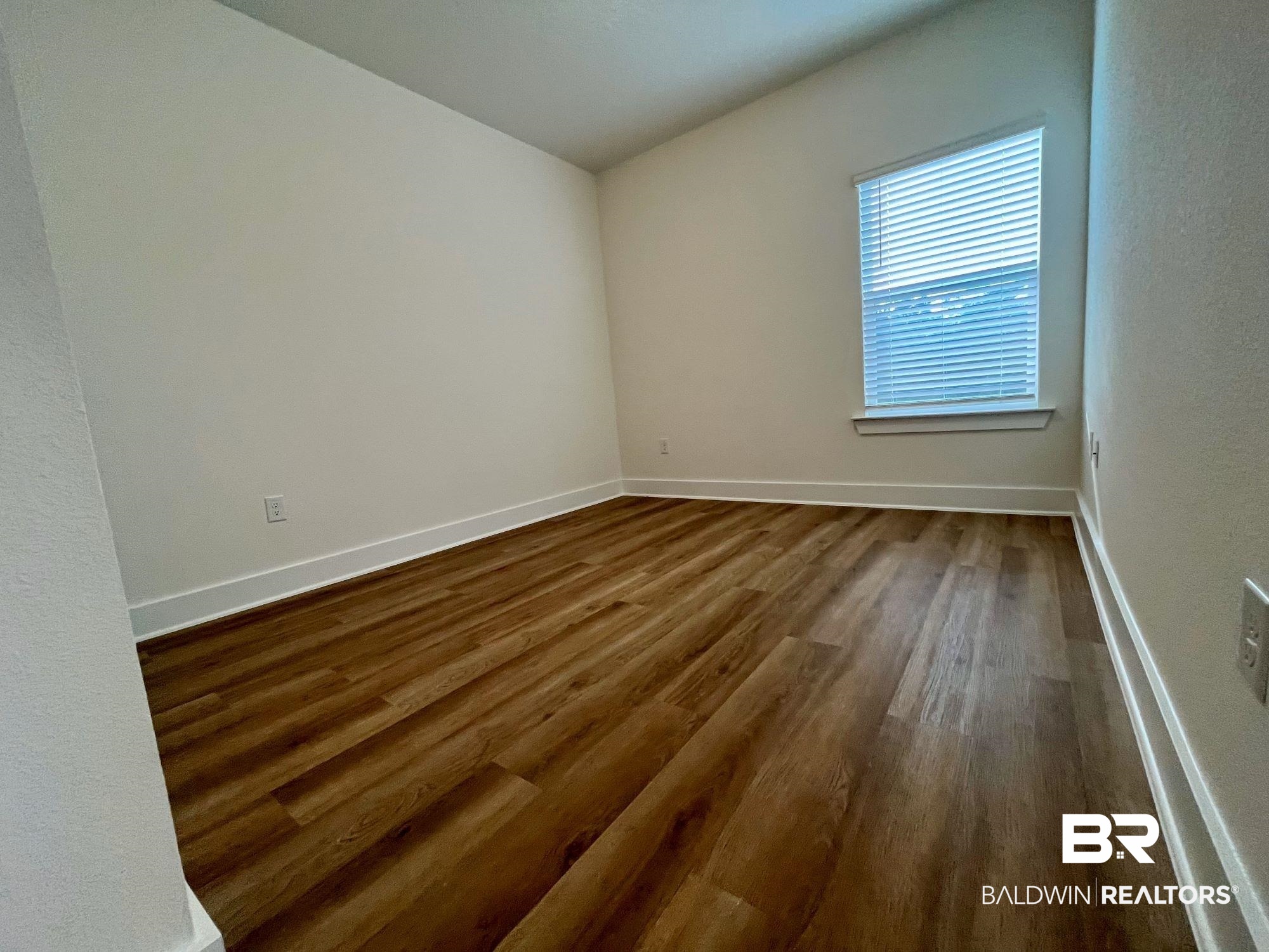 337 Barndling Street Fairhope, AL 36532 - Photo 19 of 34 Unfurnished room with dark hardwood / wood-style floors