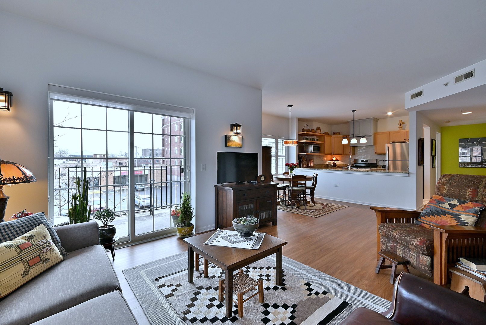 210 North Addison Avenue, Unit 301 Elmhurst, IL 60126 - Photo 11 of 30 a living room with furniture and a fireplace