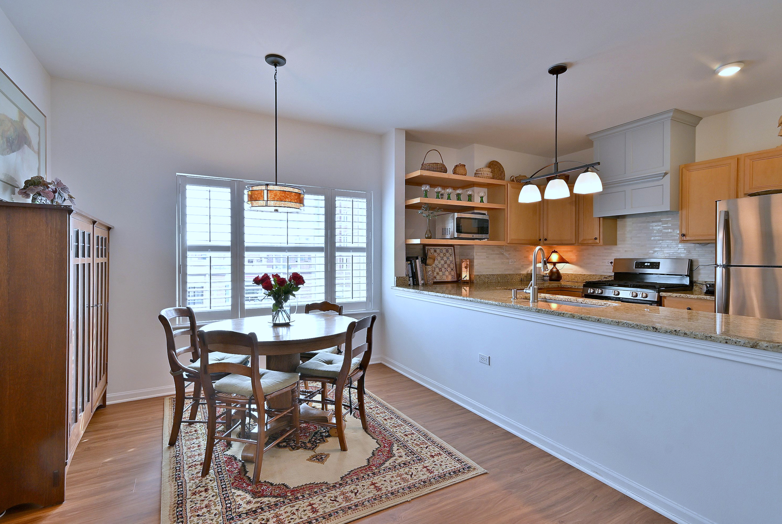 210 North Addison Avenue, Unit 301 Elmhurst, IL 60126 - Photo 13 of 30 a view of a dining room with furniture window and wooden floor