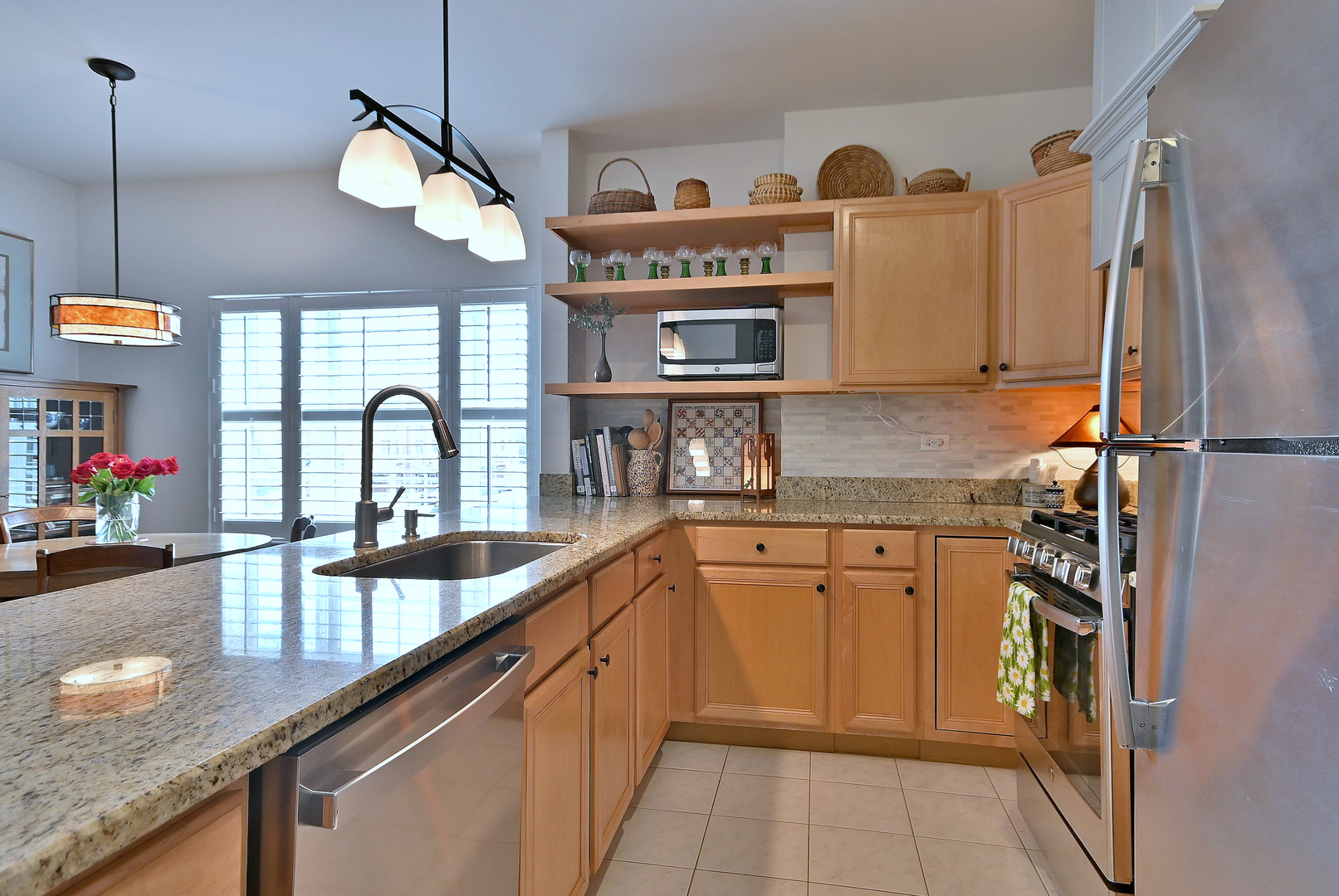 210 North Addison Avenue, Unit 301 Elmhurst, IL 60126 - Photo 16 of 30 a kitchen with stainless steel appliances granite countertop a sink and a stove