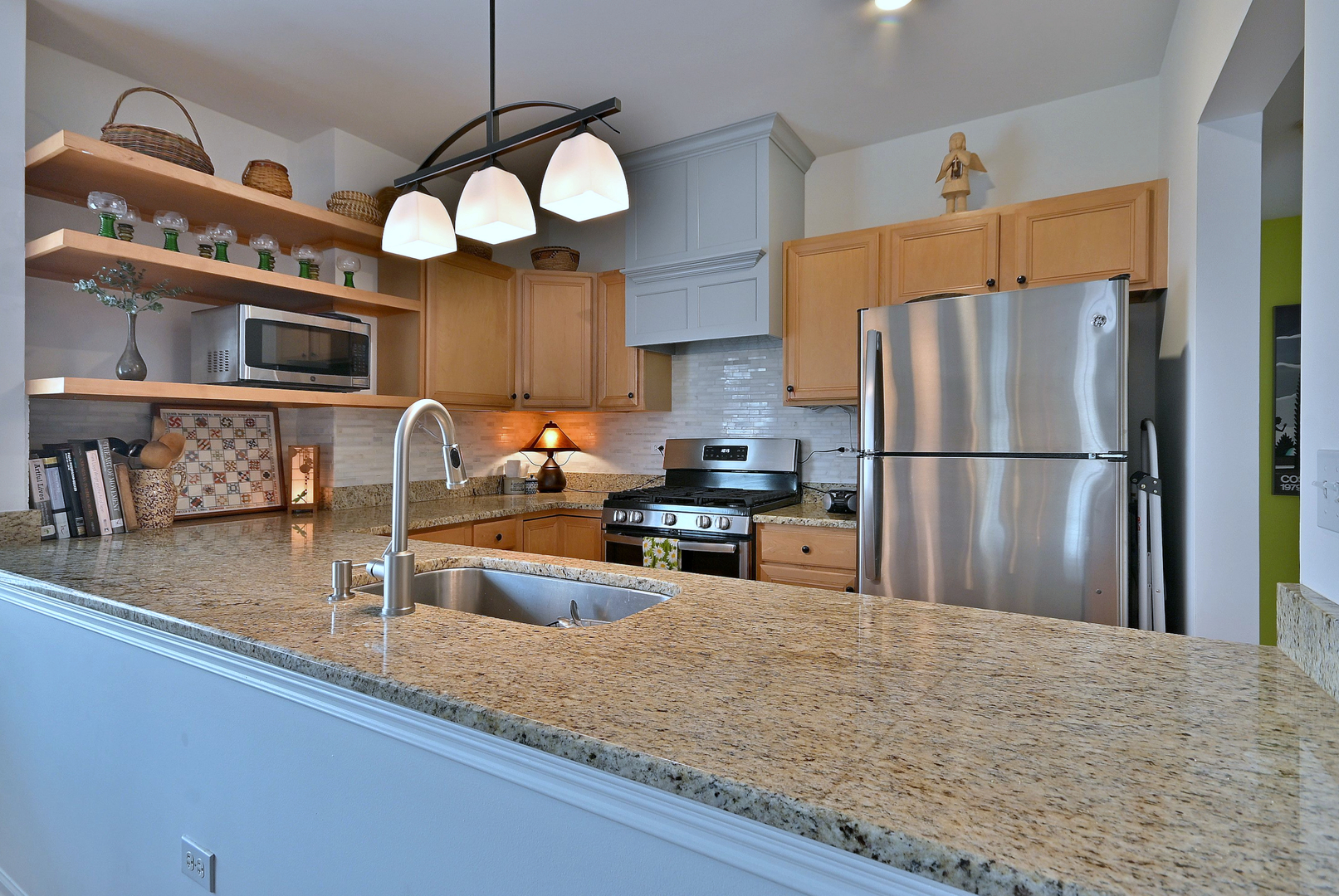 210 North Addison Avenue, Unit 301 Elmhurst, IL 60126 - Photo 18 of 30 a kitchen with stainless steel appliances granite countertop a refrigerator a oven and a sink with granite countertops