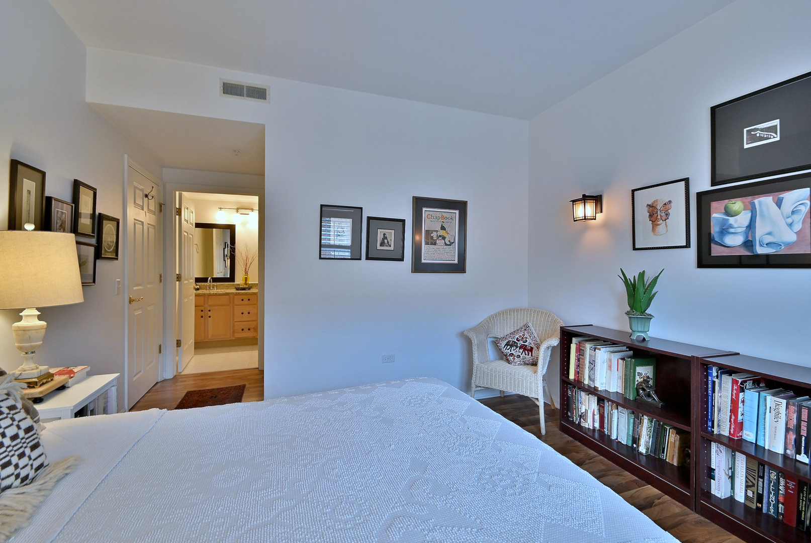 210 North Addison Avenue, Unit 301 Elmhurst, IL 60126 - Photo 20 of 30 a bedroom with furniture and a book shelf