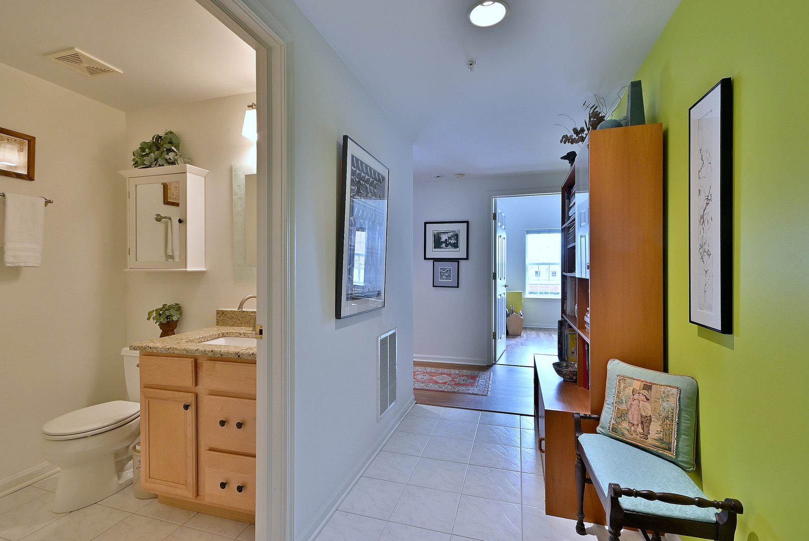 210 North Addison Avenue, Unit 301 Elmhurst, IL 60126 - Photo 22 of 30 a spacious bathroom with a toilet sink and mirror
