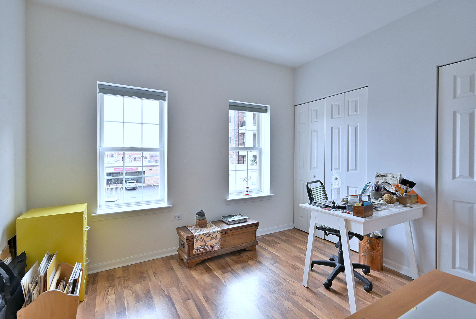 210 North Addison Avenue, Unit 301 Elmhurst, IL 60126 - Photo 23 of 30 a living room with furniture and a wooden floor
