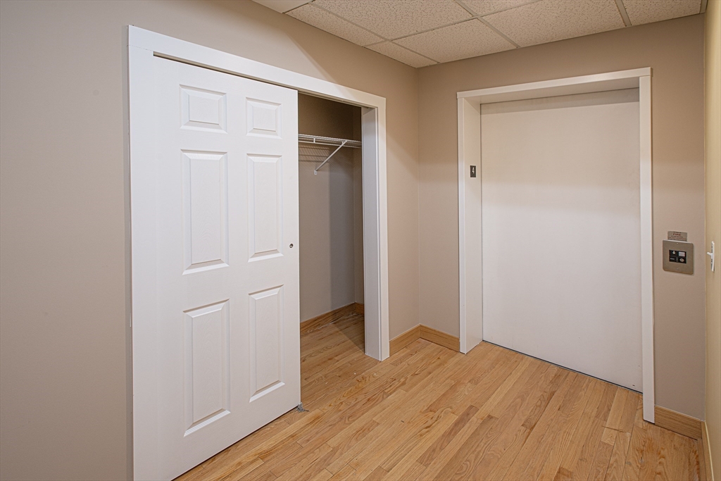 140 Main Street, Unit 3 Northampton, MA 01060 - Photo 9 of 14 a view of empty room with wooden floor