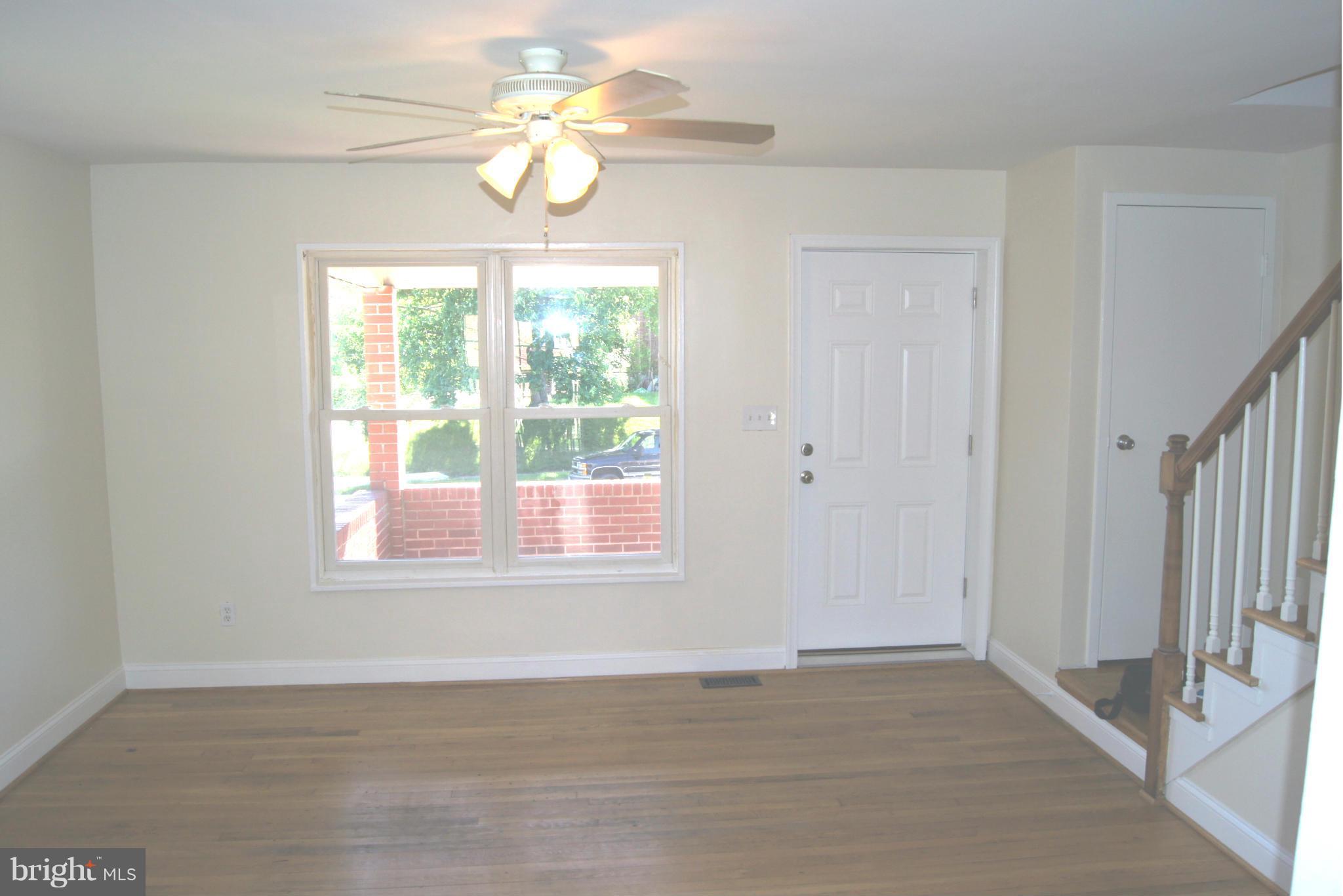 7954 Charlesmont Road Baltimore, MD 21222 - Photo 3 of 24 a view of an empty room with a window