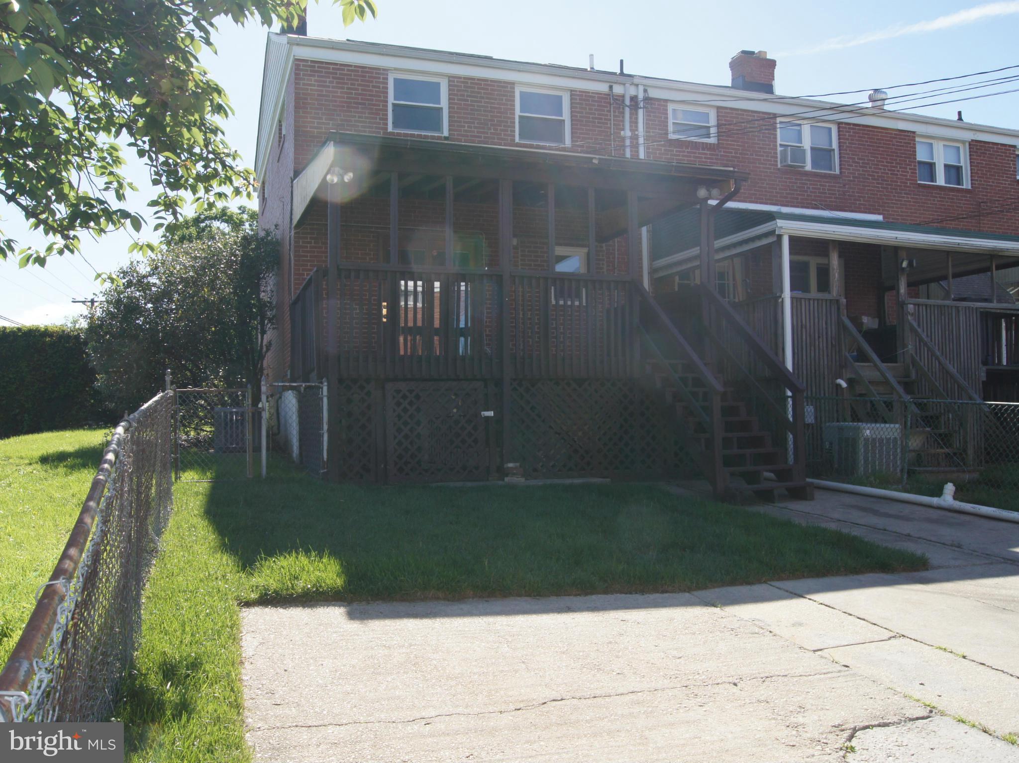 7954 Charlesmont Road Baltimore, MD 21222 - Photo 21 of 24 a front view of a house with a yard