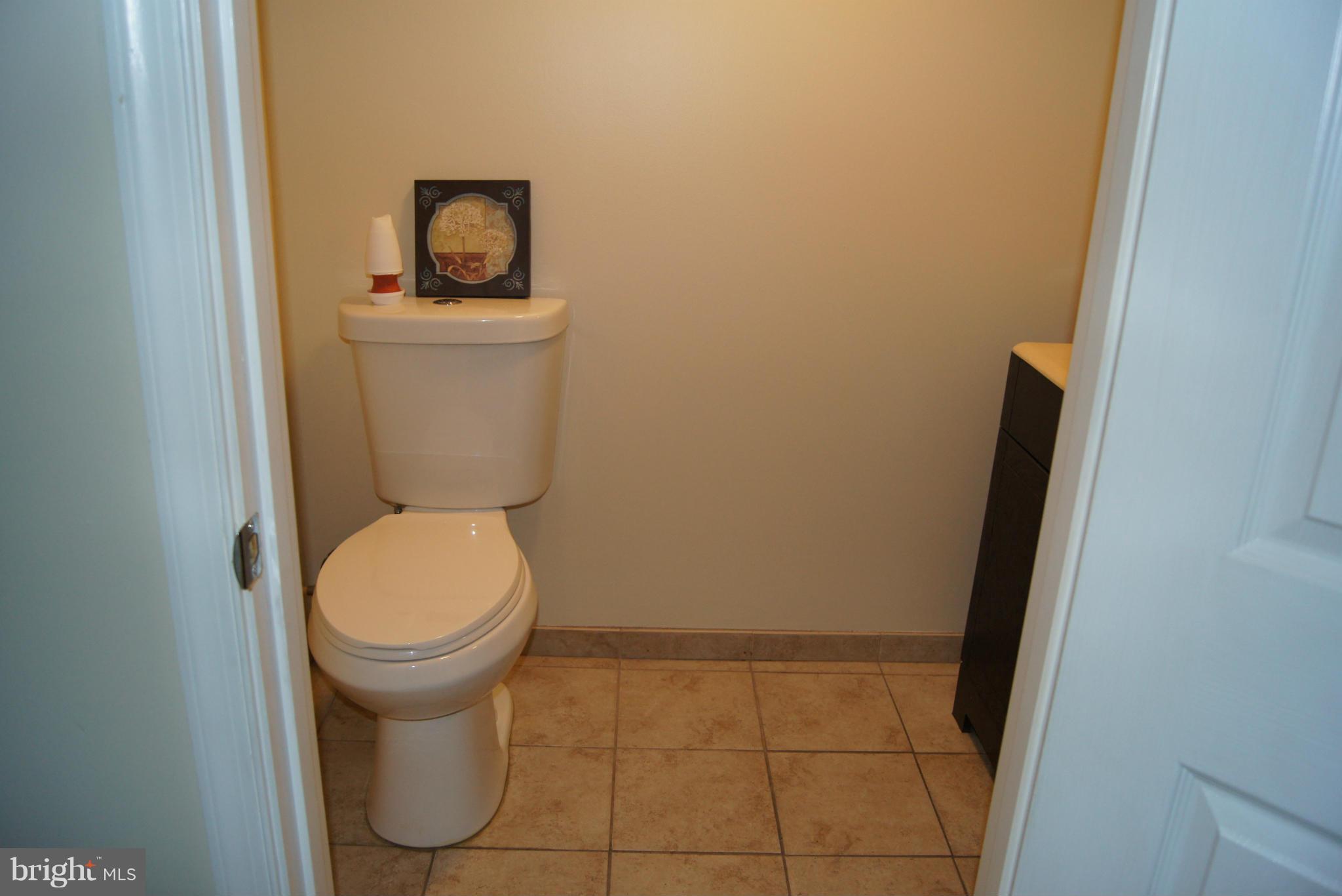 7954 Charlesmont Road Baltimore, MD 21222 - Photo 7 of 24 a bathroom with a toilet and a sink