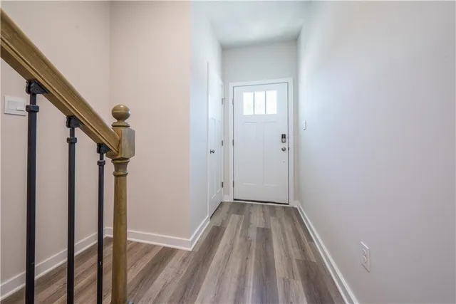 a view of entryway with wooden floor