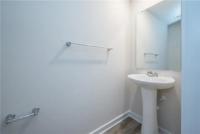 a bathroom with a sink and mirror