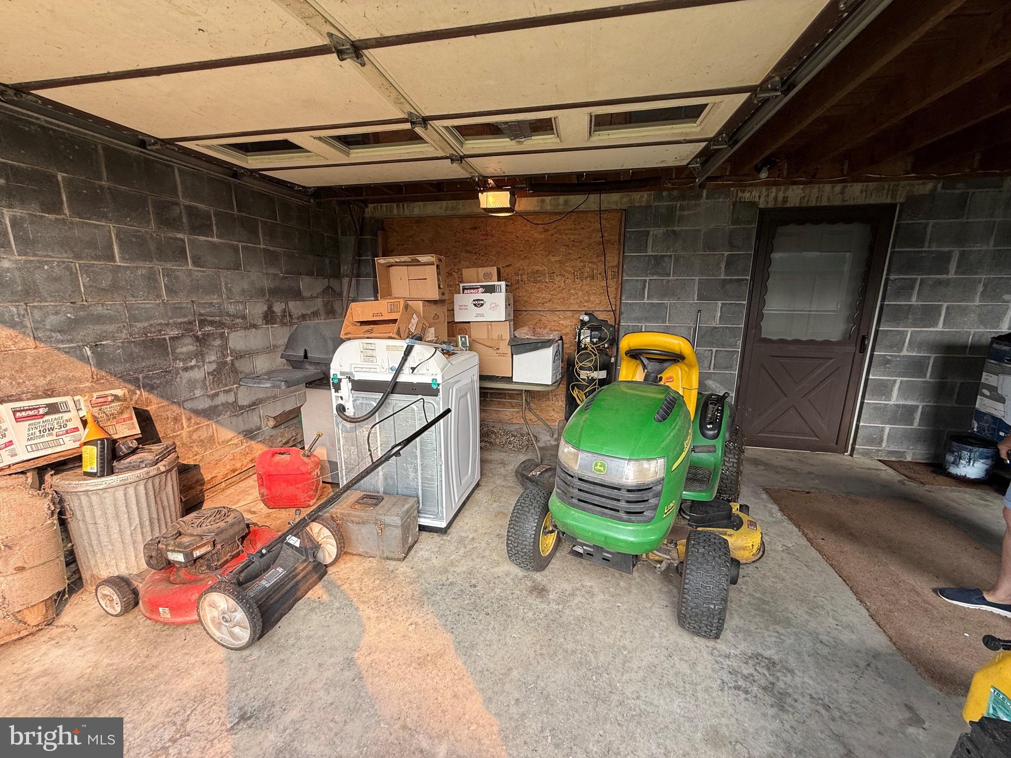 1492 Dice Warner Road Circleville, WV 26804 - Photo 29 of 36 Functional garage with tools and equipment.