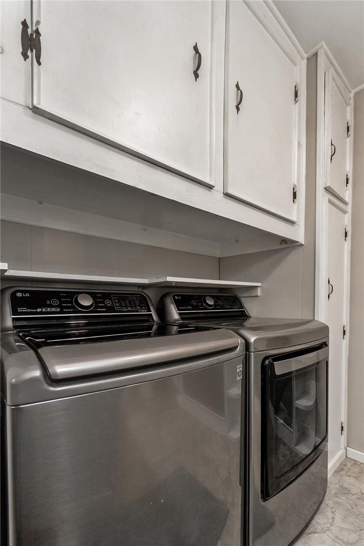 331 East Lizard Creek Road Lehighton, PA 18235 - Photo 26 of 37 Streamlined laundry area with a matching washer and dryer beneath ample storage cabinetry.