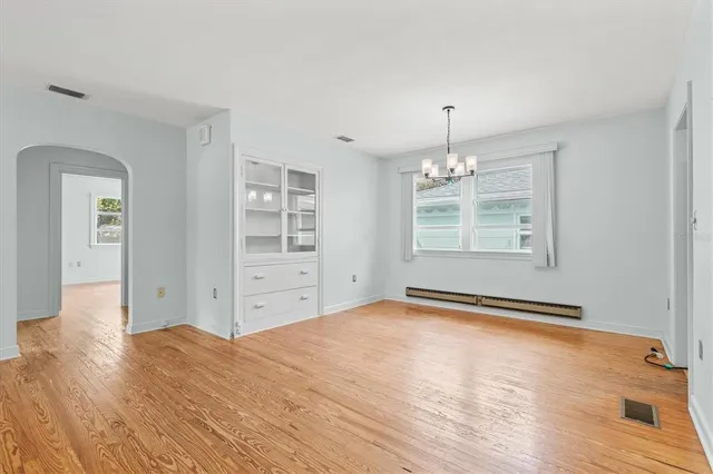 a kitchen with a sink cabinets and window