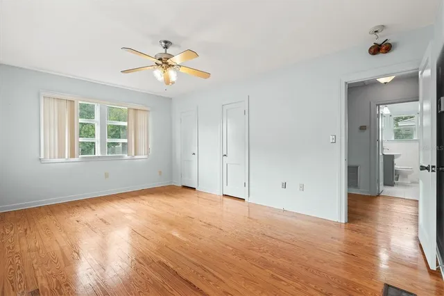 a view of a house with swimming pool and a yard
