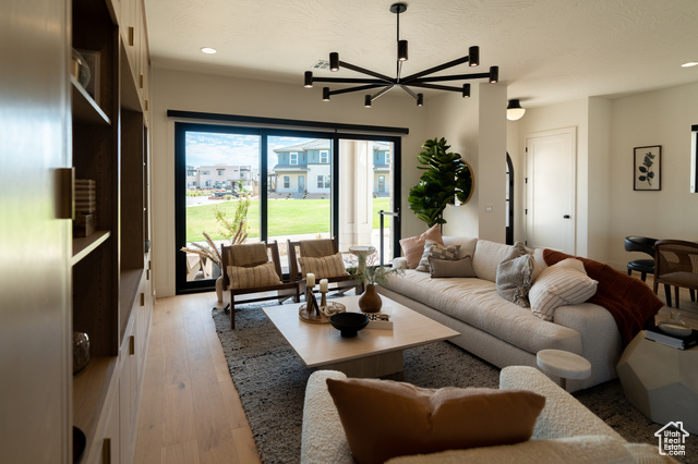 5366 Cyan Lane St. George, UT 84790 - Photo 6 of 39 Living room with recessed lighting, light wood-type flooring, and a textured ceiling