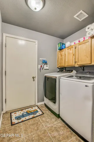 a bedroom with a bed and a table in it