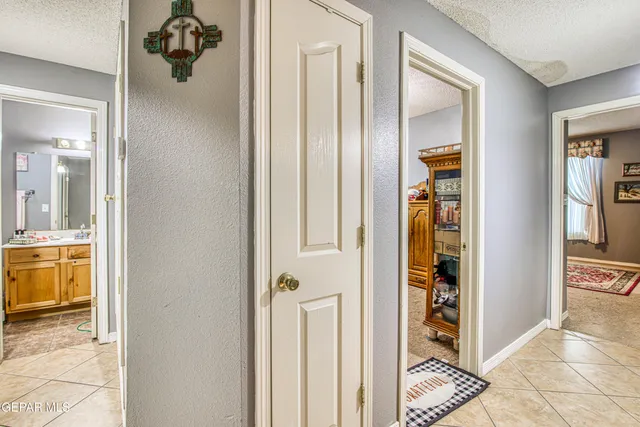 a bedroom with furniture and flat screen tv