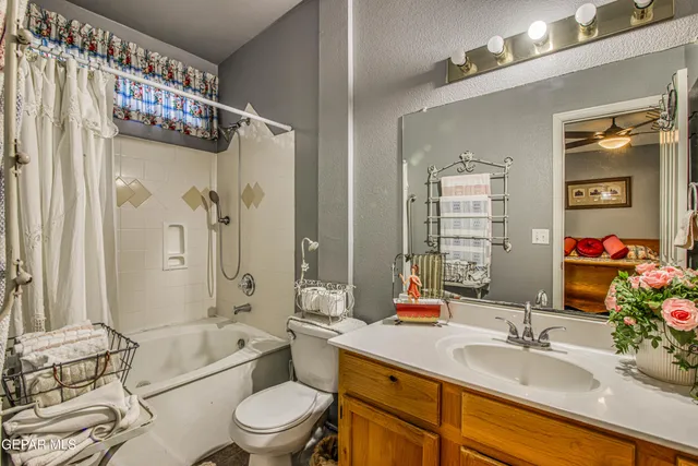 a view of a hallway with furniture and floor to ceiling window