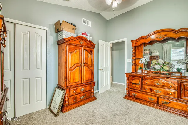 a bedroom with furniture and a window