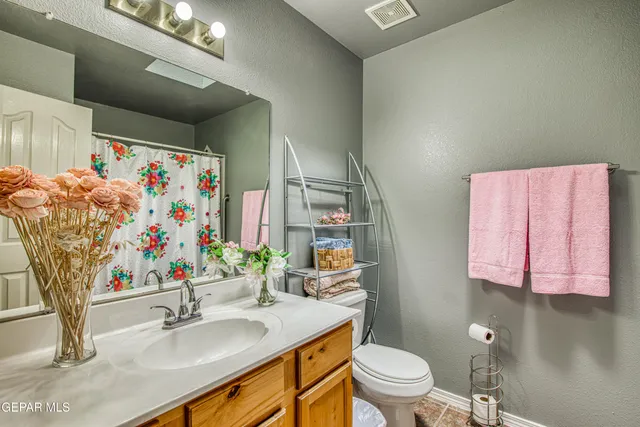 a view of a porch with a table and chairs