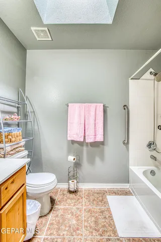 a view of a chair and table in the patio