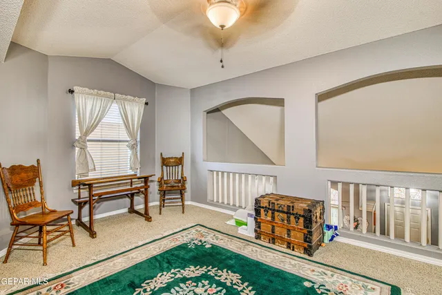 an aerial view of a house with a mountain