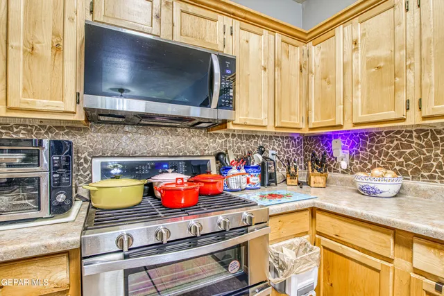 a dining room with furniture wooden floor and a rug