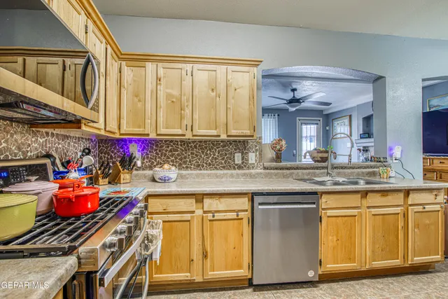 a view of a dining room with furniture and chandelier