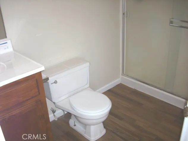 a white toilet sitting next to a bathroom sink