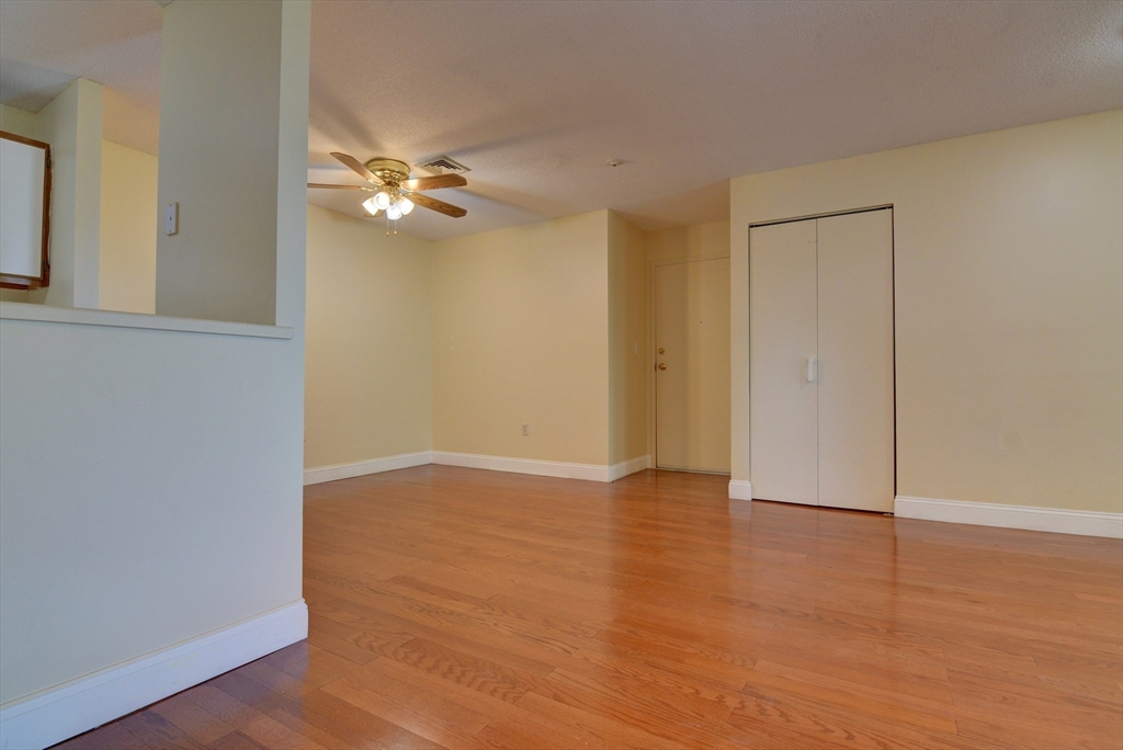 15 Bower Road, Unit A11 Quincy, MA 02169 - Photo 15 of 29 a view of an empty room with wooden floor