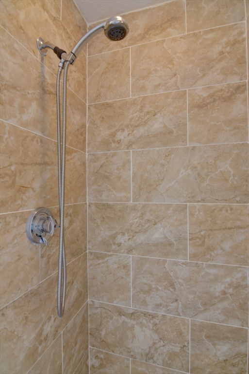 15 Bower Road, Unit A11 Quincy, MA 02169 - Photo 23 of 29 a bathroom with a shower