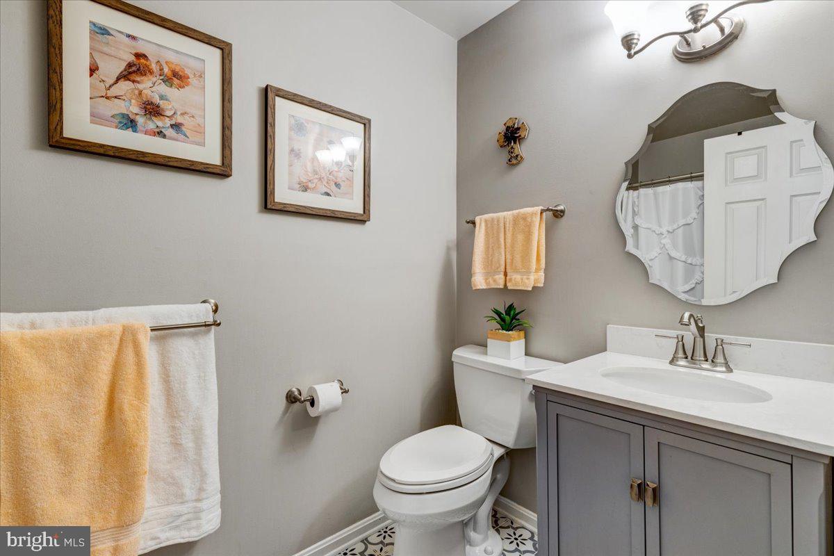13228 Clipper Circle Solomons, MD 20688 - Photo 21 of 39 Owner's Bathroom has shower/tub, new tile + vanity